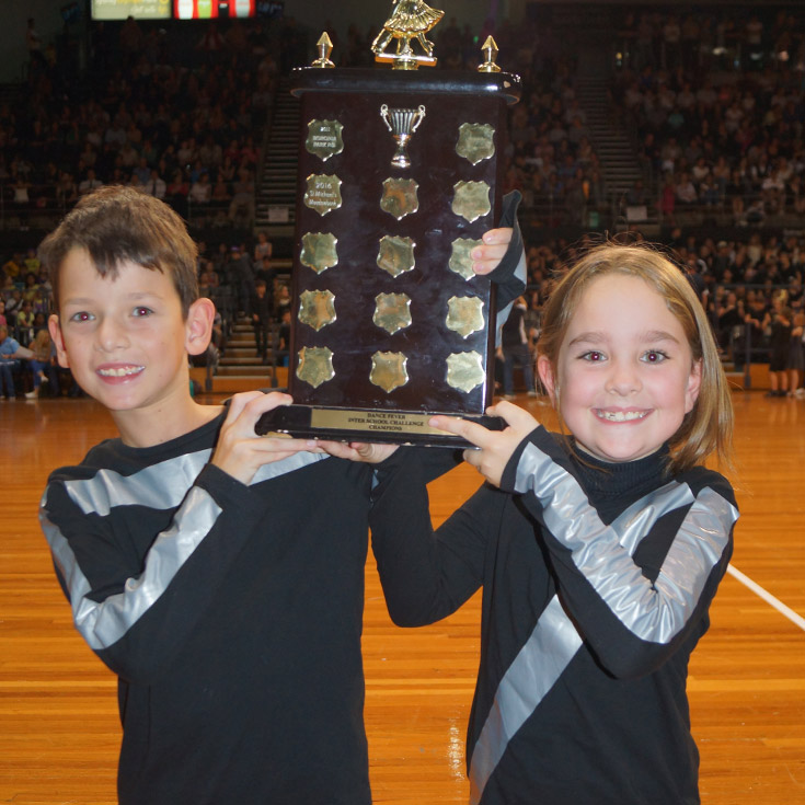 Students holding a trophy together representing sport at Our Lady of the Angels Primary School Rouse Hill