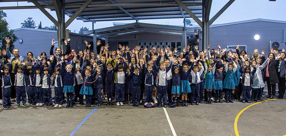 Students celebrate at the blessing of the new Catholic Out of School Hours Care service at Our Lady of the Angels Primary School, Rouse Hill