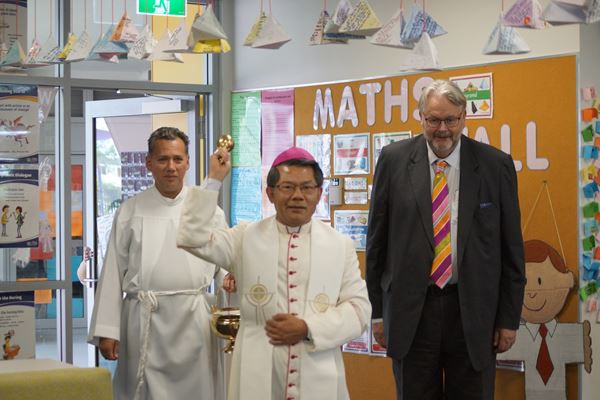 Bishop Vincent blesses the new learning spaces, accompanied by Mr Greg Whitby.