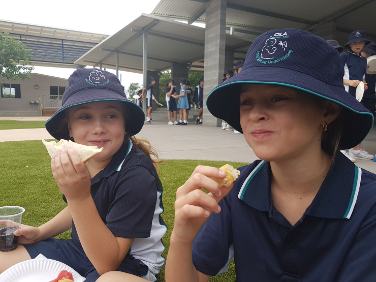 Georgia and Ava enjoying their food.