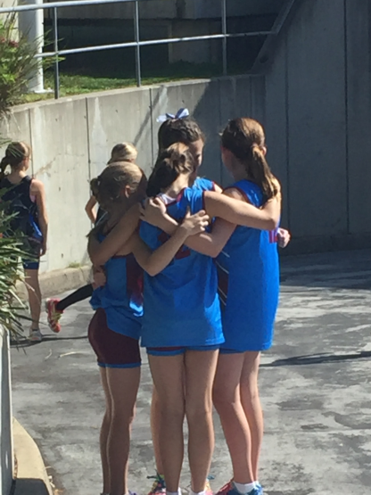 The girls huddled together and giving each words of encouragement.