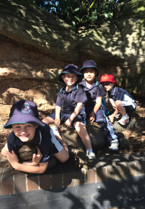 Some boys catching a crocodile.