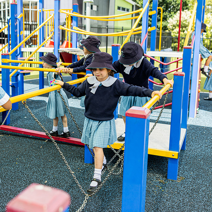 A student playing in the playground at Our Lady of the Angels Primary School Rouse Hill
